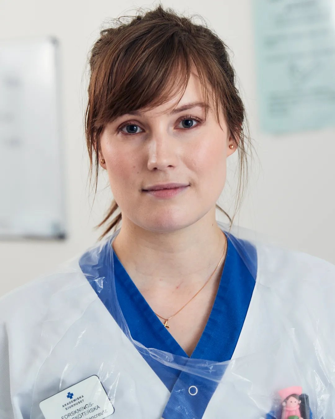 A woman in a white doctor coat.